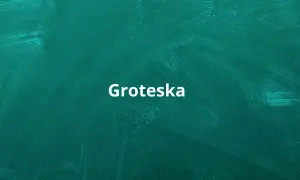 Biały napis "Groteska" na zielonej tablicy. Co to groteska? To styl, który łączy elementy realistyczne z fantastycznymi, często w sposób humorystyczny lub absurdalny.